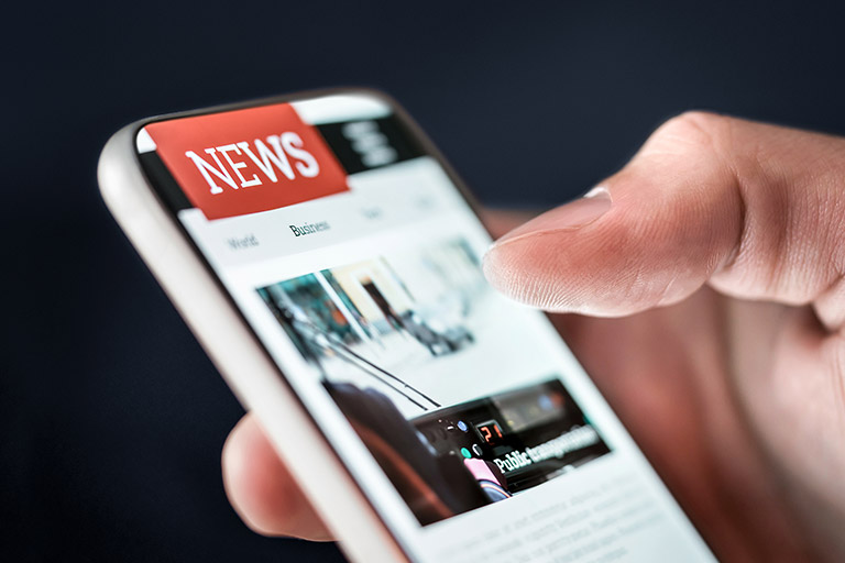 Newsletter in phone. Digital press publication.